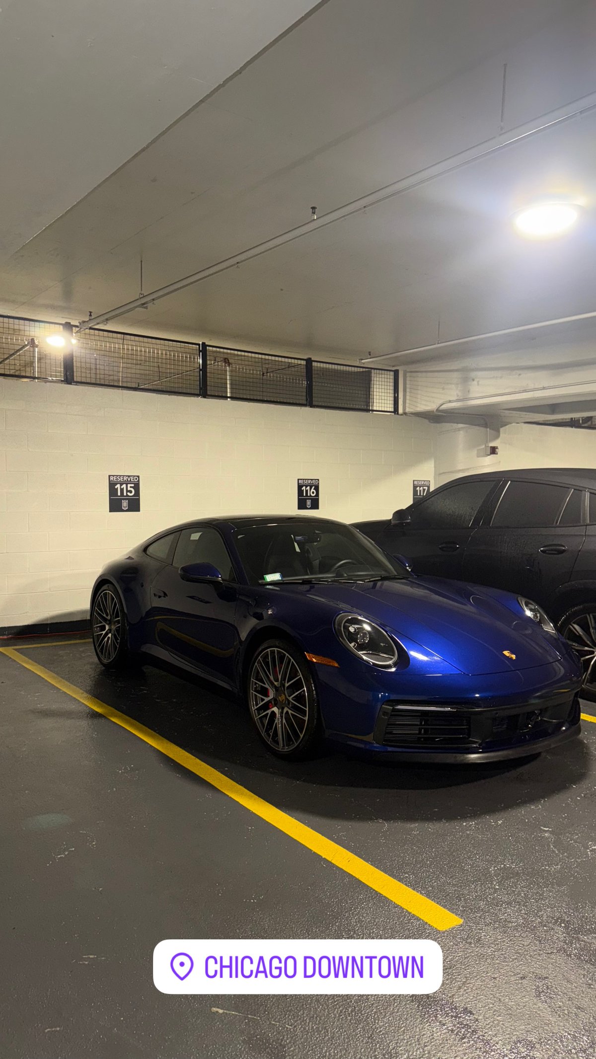 Blue Porsche 911 detailed in Chicago downtown parking garage